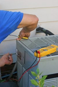 technician working on ac unit