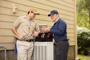 two-technicians-working-on-hvac-system