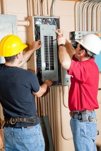 electricians-working-on-electrical-panel