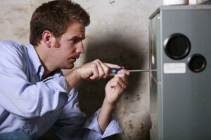 technician-working-on-heating-system