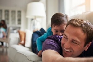 father-and-son-laying-on-couch