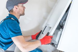 technician-working-on-an-HVAC-system